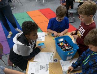 students building with Legos 